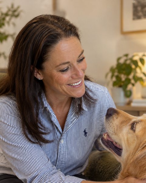 Dr Sarah Fraser with a golden retriever
